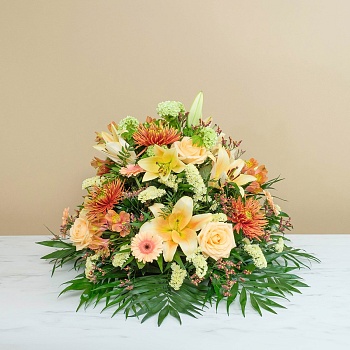 Funeral composition in gold tones
